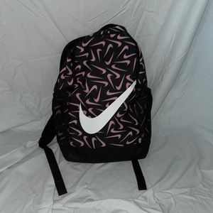 This is a nike brand bookbag. 2 cup holder pockets. black, white, & baby pink
